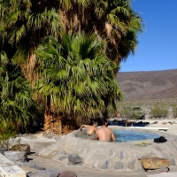 Naked Men Enjoying Themselves in a Hot Tub